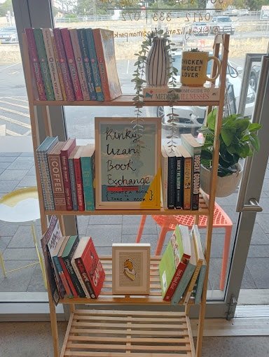 Book exchange shelf inside of Kinky Lizard Mosman Park