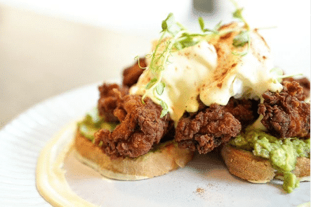 Toast with fried chicken on it with avocado