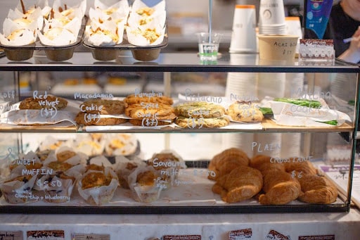 Flat lay of wholesome breakfast options including muffins, pastries, and cookies.